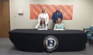Wallace State softball sophomores Brooke Kinsey, left, and Kaitlyn Whitehead have signed to play for the Blue Mountain College Lady Toppers, beginning with the 2016 season. Also pictured are, from left, Wallace State softball coach Jayne Clem and Blue Mountain coach Kevin Barefield.