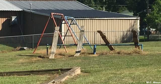 West Point Elementary School Playground Project receives construction grant wooden_seesaws_and_dangersous_edging_around_current_playsets.jpg