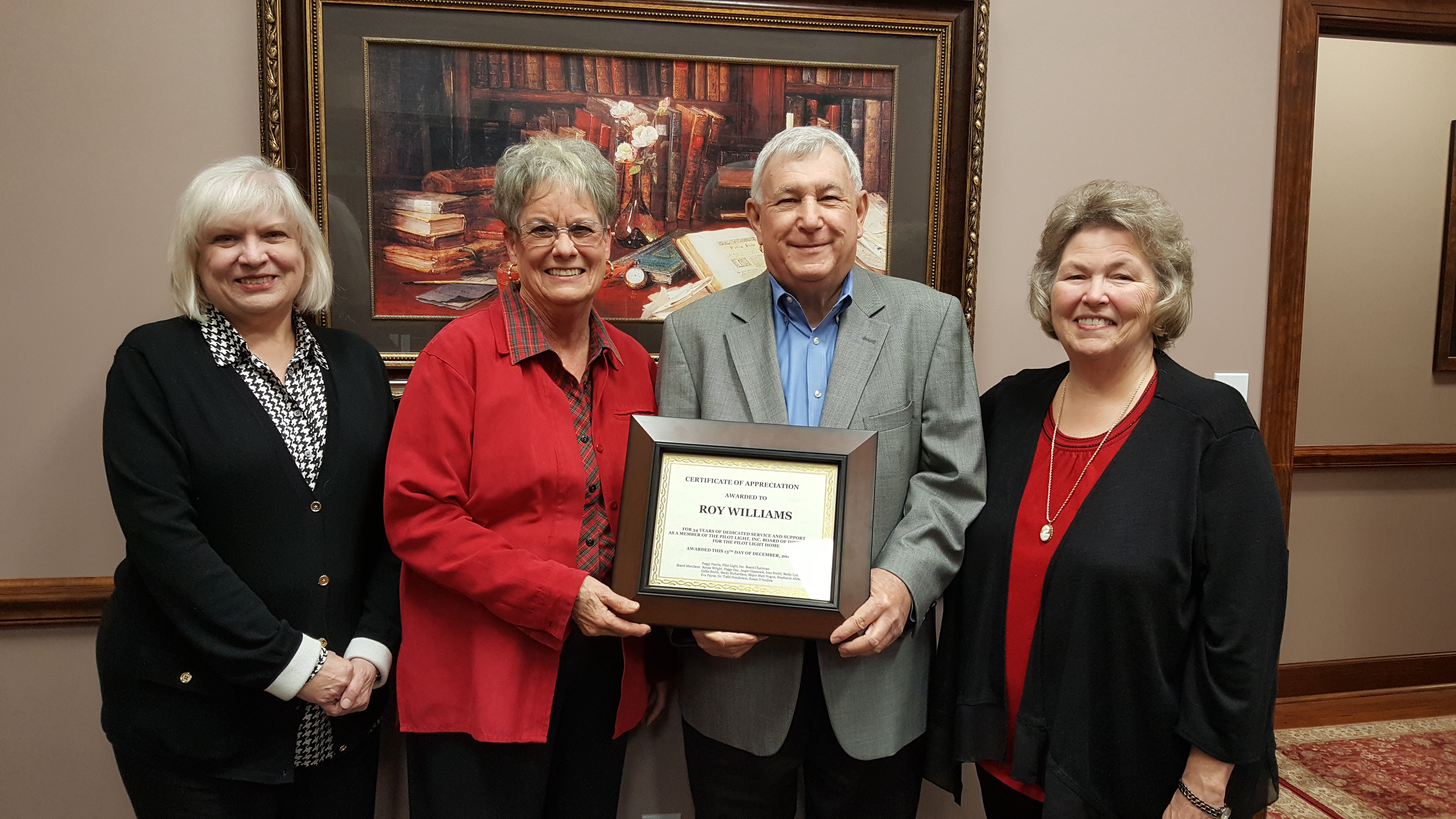 Pilot Light awards certificate of appreciation to Roy Williams Peggy Harris
