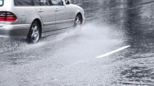 stock-image-of-car-driving-through-heavy-rain-136392769938903901-140818150138.jpg