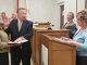 New councilmember Stam sworn at Hanceville’s council meeting John Stam is sworn in Thursday night while wife, Deborah, holds the bible and Hanceville clerk Tania administers the oath of office