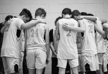 Hoop Faith One of this year's K.B.A teams prays after a game. (Martha Needham for The Cullman Tribune)