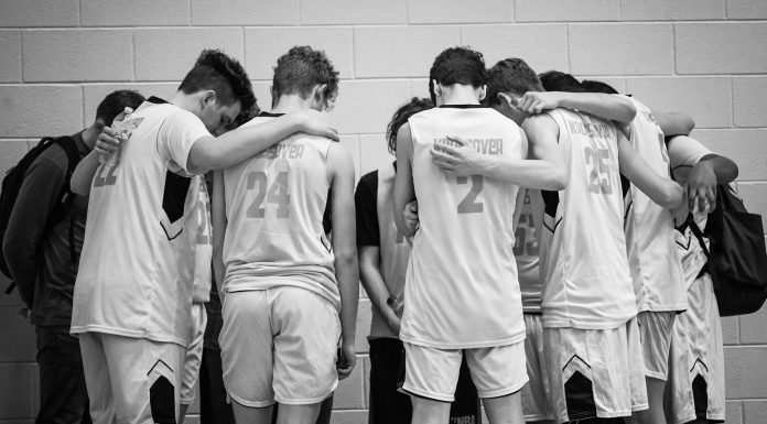 Hoop Faith One of this year's K.B.A teams prays after a game. (Martha Needham for The Cullman Tribune)