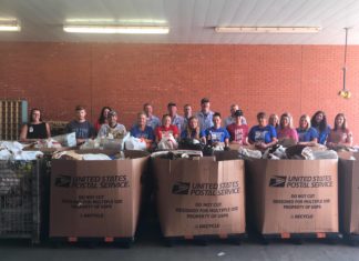 Letter carriers collect 10K pounds of food in annual food drive