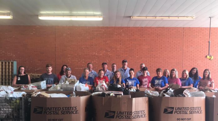 Letter carriers collect 10K pounds of food in annual food drive