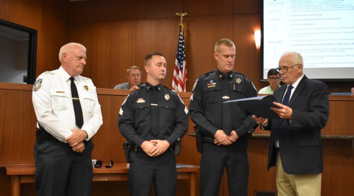 Cullman council honors police officers for promotions, years of service