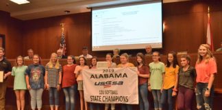 City signs off on access road project, recognizes local athletes