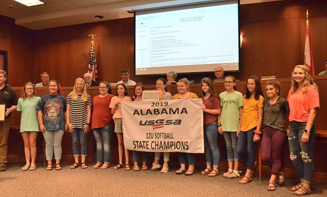 City signs off on access road project, recognizes local athletes