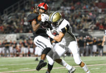 PREP FOOTBALL: 2nd-ranked Trojans handle Bearcats 45-0
