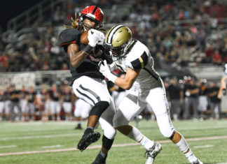 PREP FOOTBALL: 2nd-ranked Trojans handle Bearcats 45-0