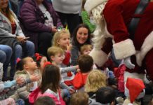 A heart for Christmas: Walmart brings Santa, cheer to Child Development Center