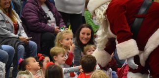 A heart for Christmas: Walmart brings Santa, cheer to Child Development Center