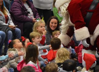 A heart for Christmas: Walmart brings Santa, cheer to Child Development Center