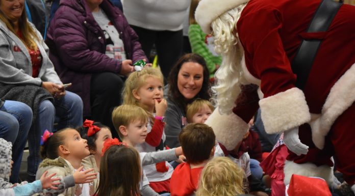 A heart for Christmas: Walmart brings Santa, cheer to Child Development Center