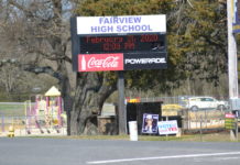 Merrill: Signs regarding 1-cent tax improperly placed around schools