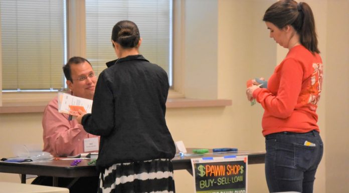 A mile in their shoes: CCPS faculty, staff participate in ‘poverty simulator’ to gain better understanding of students in need