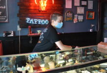 Local tattoo parlors following, establishing health guidelines for customers
