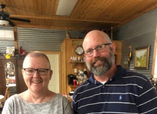 ‘She’s not alone’: Boss shaves head to support employee with cancer