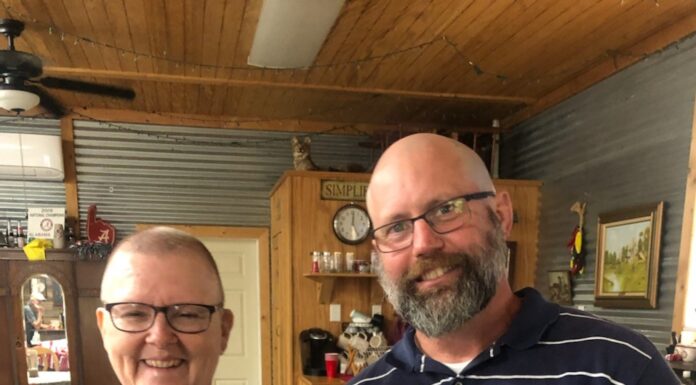 ‘She’s not alone’: Boss shaves head to support employee with cancer