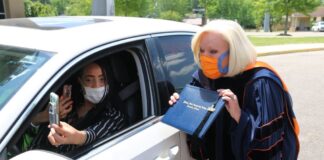 Wallace State President Dr. Vicki Karolewics awards diploma via FaceTime during drive-thru graduation celebration
