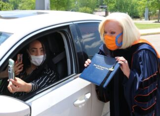Wallace State President Dr. Vicki Karolewics awards diploma via FaceTime during drive-thru graduation celebration