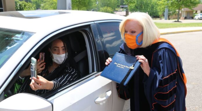Wallace State President Dr. Vicki Karolewics awards diploma via FaceTime during drive-thru graduation celebration