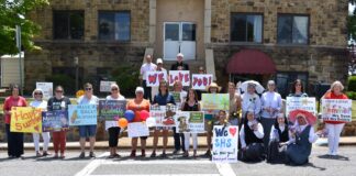 Sacred Heart School sends off students with drive-thru parade