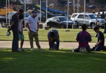Local residents meet to pray at Depot Park after days of unrest nationwide