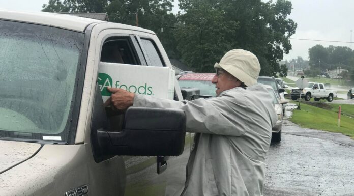 Helping hands: Weekly distribution of food boxes for area senior citizens resumes