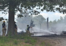 Abandoned house burns near south Wal-Mart