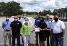 City presents check for paving at CHS