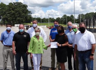 City presents check for paving at CHS