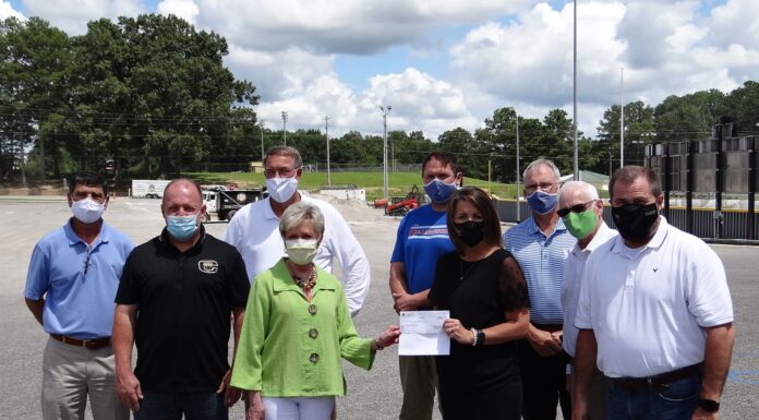 City presents check for paving at CHS