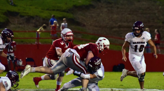 PREP FOOTBALL: Battle in the Swamp: Raiders put game away late, 31-14