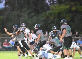 PREP FOOTBALL: Tigers upend Broncos, 56-8