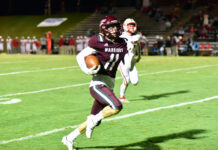 PREP FOOTBALL: Warriors punch playoff ticket in 49-0 blowout