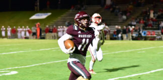 PREP FOOTBALL: Warriors punch playoff ticket in 49-0 blowout