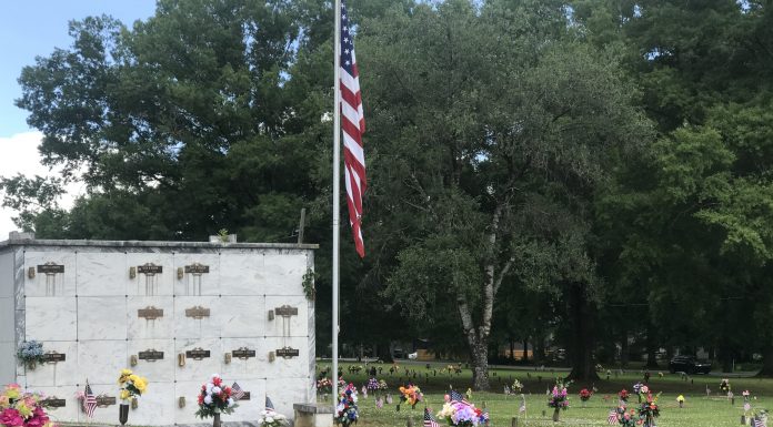 Flags placed at Cullman Memory Gardens by Cullman VFW members