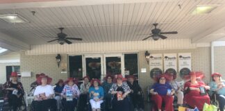 Hanceville Nursing and Rehab chapter of the Red Hat Society celebrate their completed community service project