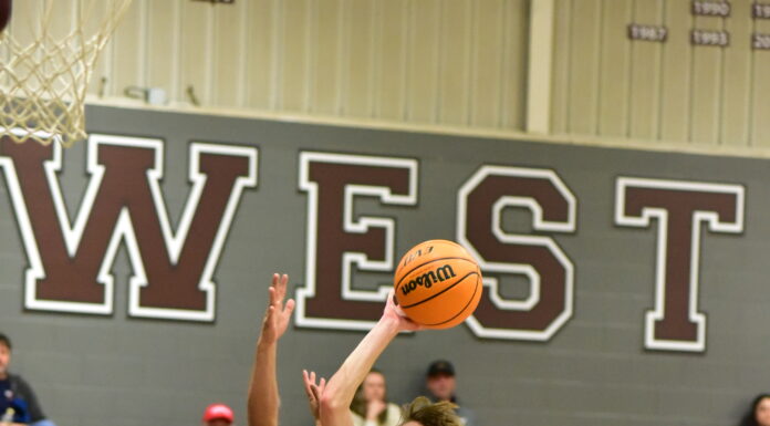 PREP BASKETBALL: Wheeler’s late free throws lift Warriors over Tigers 66-64, Lady Warriors handle Russellville 62-34