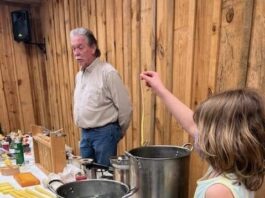 President of the Cullman Beekeeping Association teaches candle making class at the Agriplex