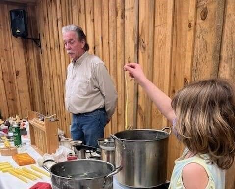 President of the Cullman Beekeeping Association teaches candle making class at the Agriplex