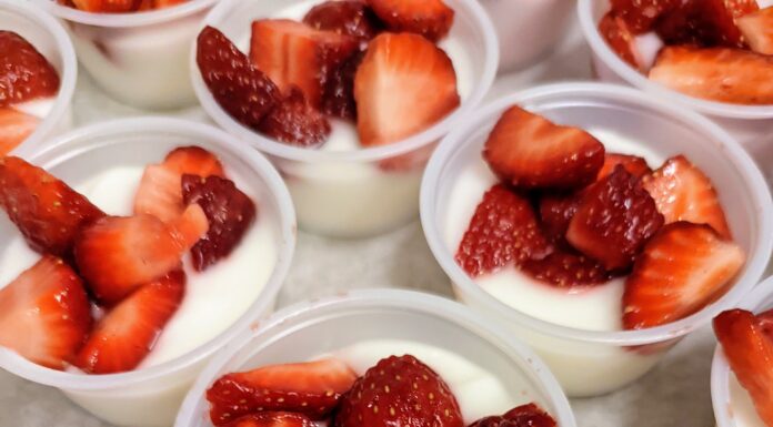 West Elementary students celebrate healthy eating with strawberries provided by Farm to Table