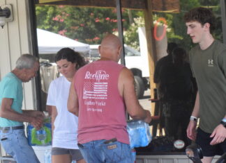 Redline Leather Workz celebrates new location, supports firefighters