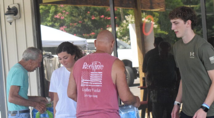 Redline Leather Workz celebrates new location, supports firefighters