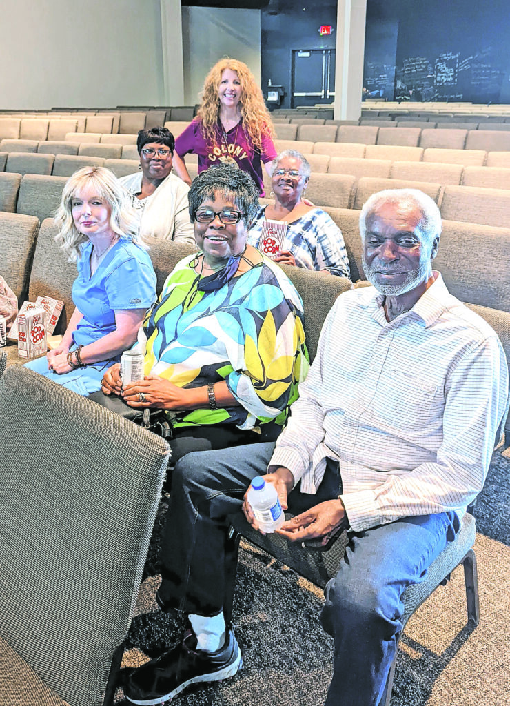Big screen, popcorn and auditorium of eager elders Cullman County