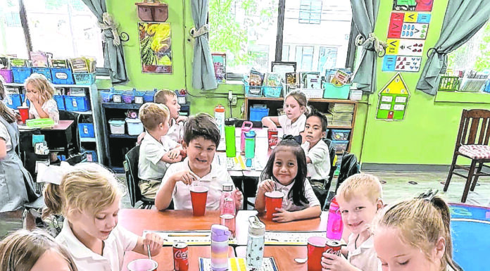 1st graders at Sacred Heart School make ‘Coke Floats’