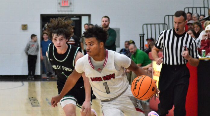 PREP BASKETBALL: Raiders race past Broncos 59-42, Lady Raiders handle Holly Pond 51-16