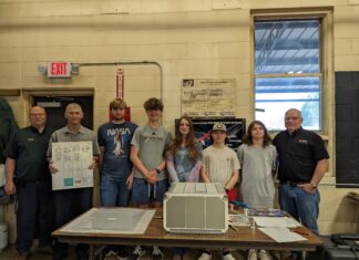 CATA students machine parts for International Space Station