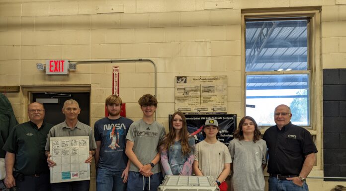 CATA students machine parts for International Space Station
